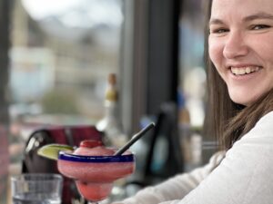 Heather Deveaux drinking a margarita in a mexican restaurant
