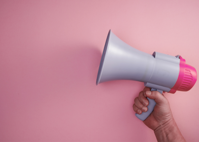 Heather Deveaux Creative irony of marketing bullhorn on pink background